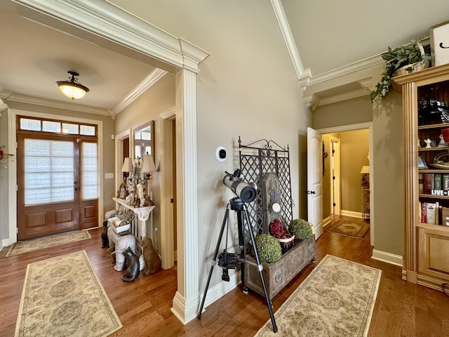 entrance foyer with hardwood / wood-style flooring and ornamental molding