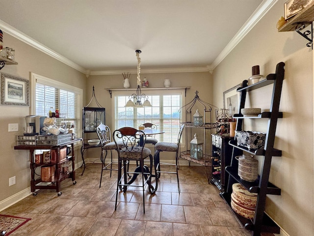 tiled dining space featuring an inviting chandelier and ornamental molding