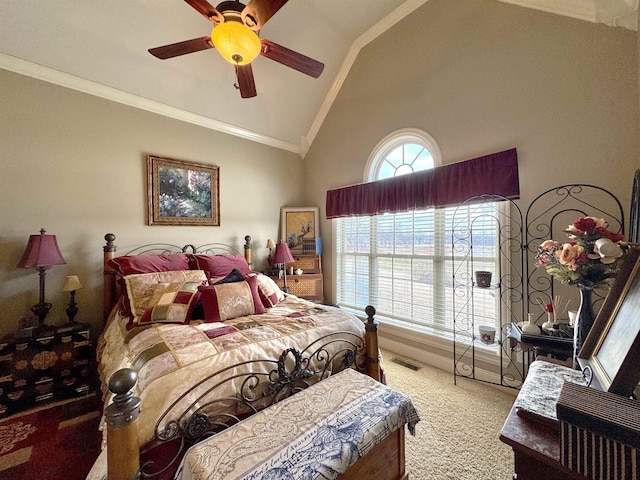 carpeted bedroom featuring ceiling fan, lofted ceiling, and ornamental molding