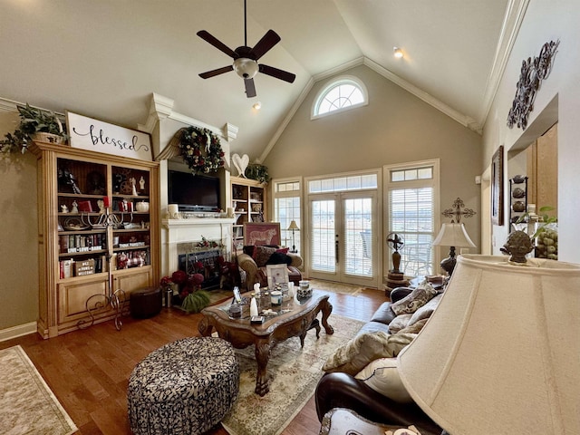 living room with high vaulted ceiling, french doors, ceiling fan, ornamental molding, and wood-type flooring