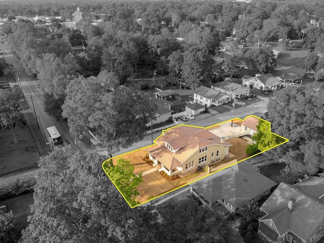 birds eye view of property with a wooded view