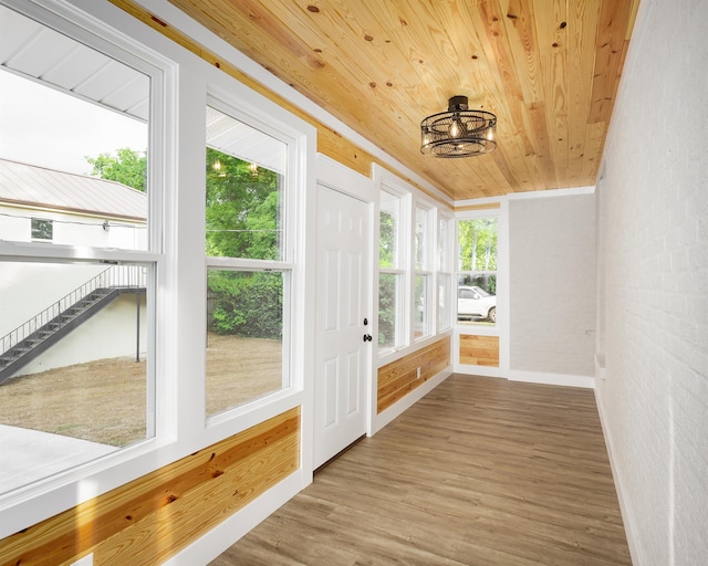unfurnished sunroom featuring plenty of natural light