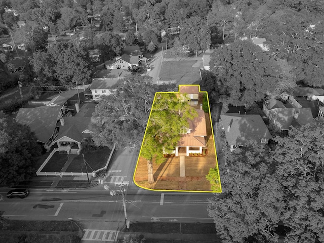 birds eye view of property with a residential view and a wooded view
