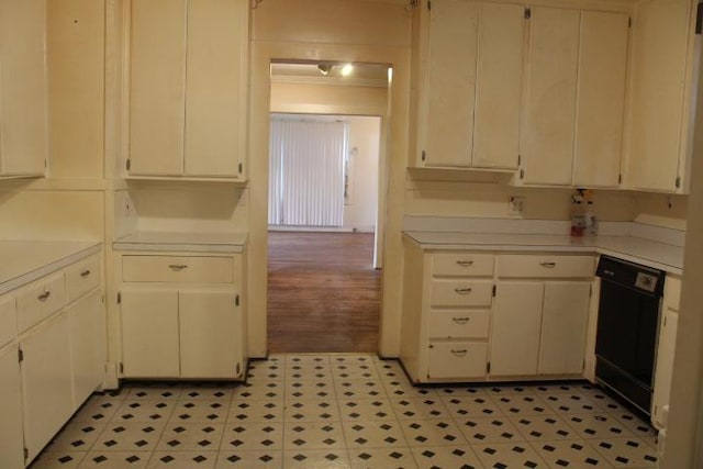 kitchen with white cabinetry and black dishwasher