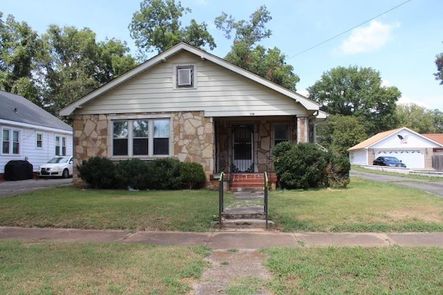 bungalow-style home with a front yard