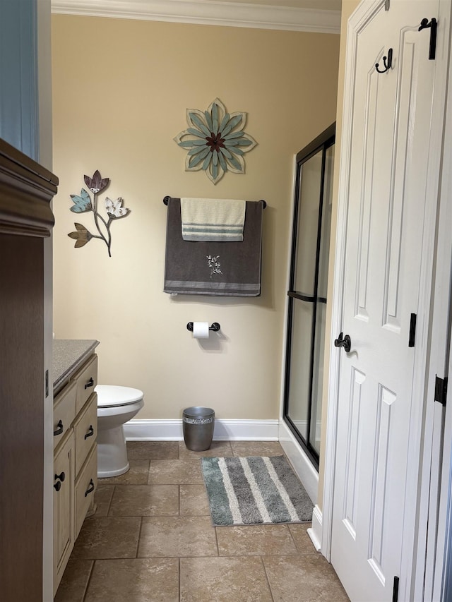  - full bath with baseboards, vanity, stone tile flooring, toilet, and crown molding