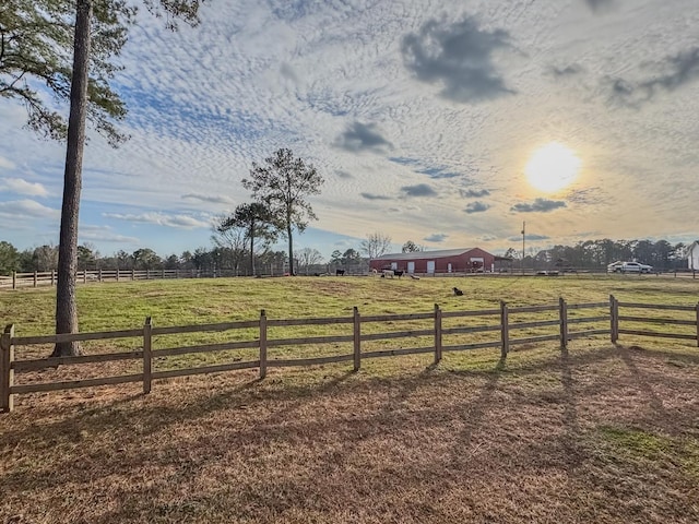 view of yard with a rural view