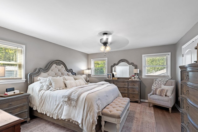 bedroom featuring dark hardwood / wood-style floors and ceiling fan