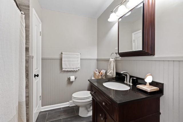 bathroom with tile patterned floors, vanity, and toilet