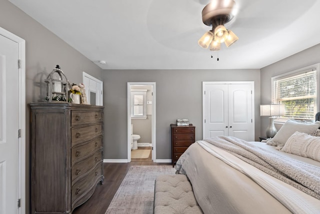 bedroom with ceiling fan, dark hardwood / wood-style floors, ensuite bathroom, and a closet