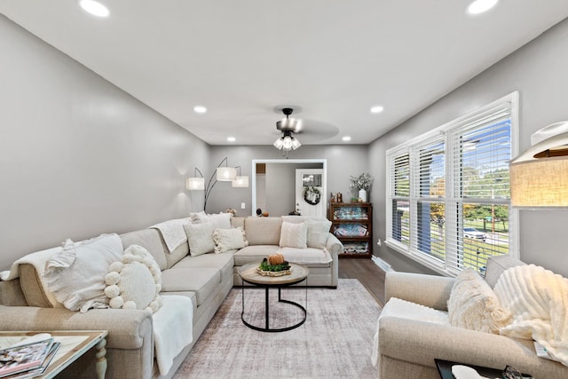 living room featuring hardwood / wood-style flooring and ceiling fan