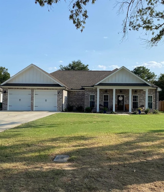 view of front of home with a front lawn and a garage