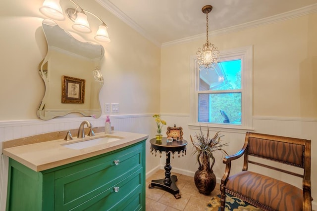 bathroom with tile patterned flooring, vanity, ornamental molding, and an inviting chandelier