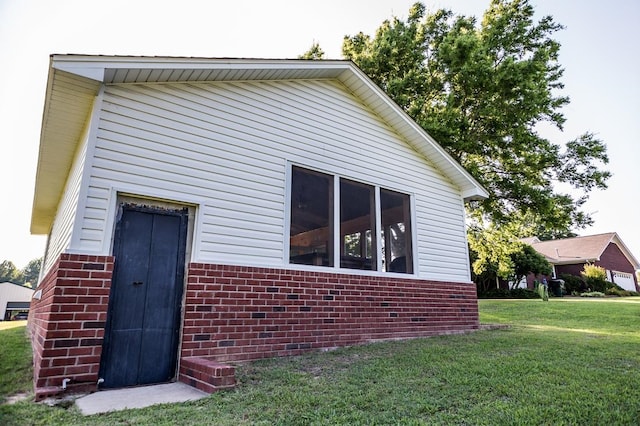 view of home's exterior featuring a yard