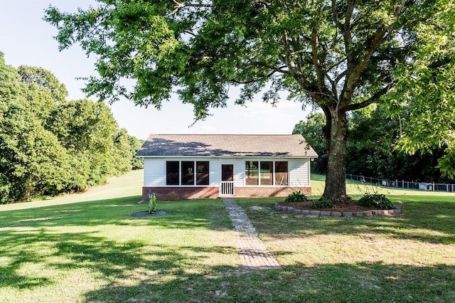 single story home featuring a front yard