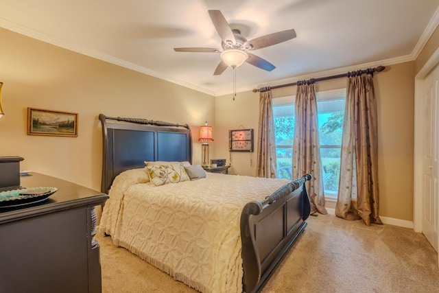 bedroom featuring ceiling fan, light colored carpet, and crown molding