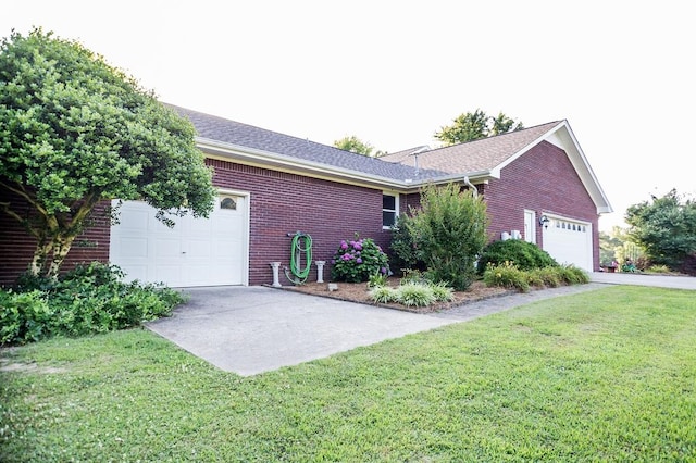 view of front of house with a front yard and a garage