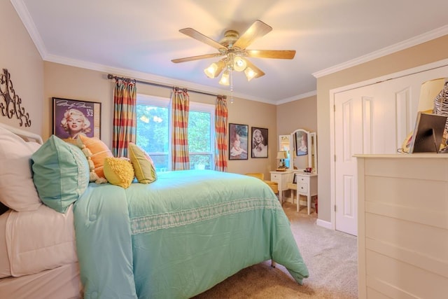 carpeted bedroom with ceiling fan and crown molding