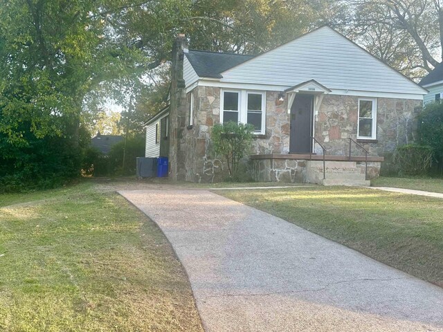 bungalow with a front lawn