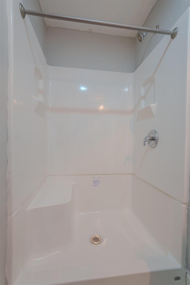 bathroom featuring walk in shower