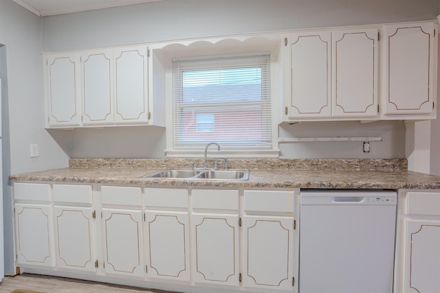 kitchen featuring light countertops, white cabinets, dishwasher, and a sink