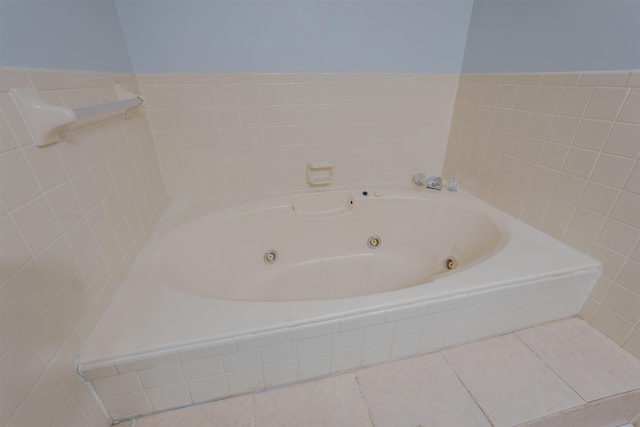 full bathroom with a jetted tub and tile patterned flooring