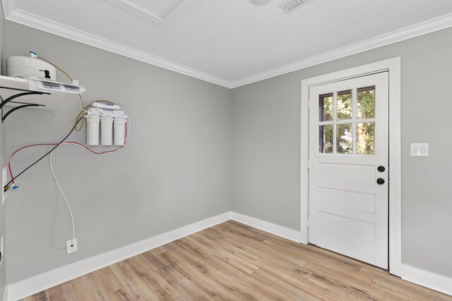  - interior space with crown molding and light wood-style floors