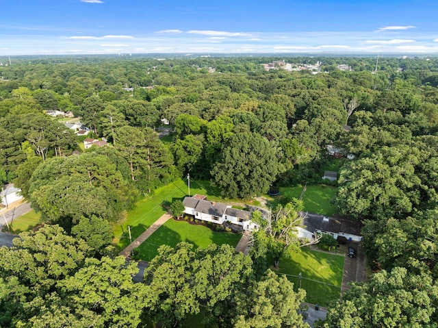  - aerial view of property and surrounding area featuring a forest