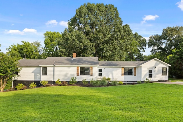  - view of front facade with a front lawn, a chimney, and crawl space
