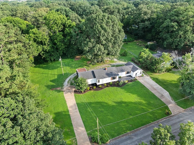  - aerial view of property's location featuring a forest