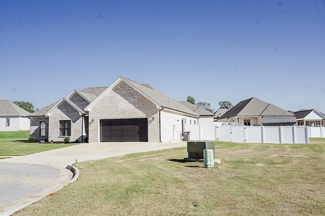 french country home with a garage and a front yard