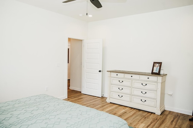 bedroom featuring light wood-type flooring and ceiling fan