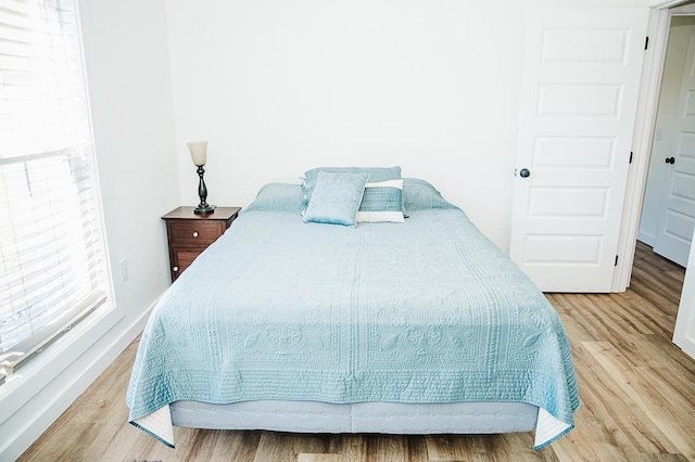 bedroom with light hardwood / wood-style floors