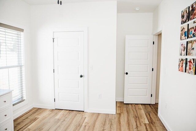 unfurnished bedroom with light hardwood / wood-style floors