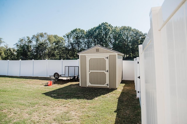 view of outbuilding with a yard