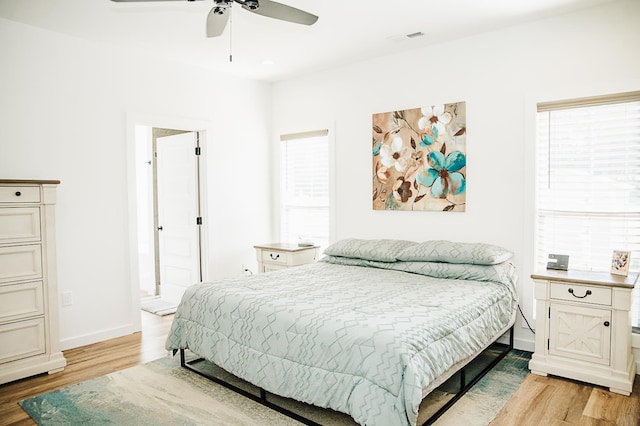 bedroom featuring light hardwood / wood-style flooring and ceiling fan