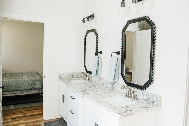 bathroom featuring vanity and hardwood / wood-style flooring