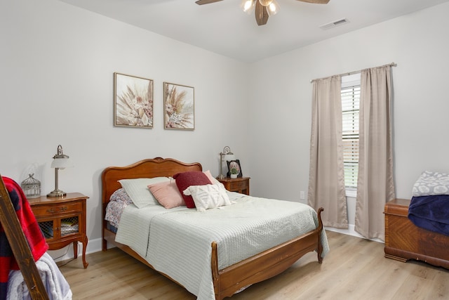 bedroom with ceiling fan and light hardwood / wood-style flooring