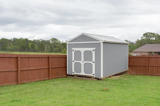 view of outdoor structure with a lawn