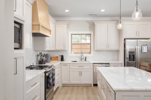 kitchen featuring tasteful backsplash, custom exhaust hood, stainless steel appliances, sink, and white cabinets