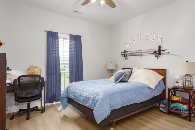 bedroom featuring hardwood / wood-style flooring and ceiling fan