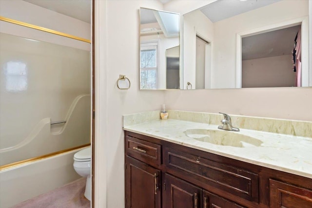 bathroom with toilet, bathtub / shower combination, and vanity