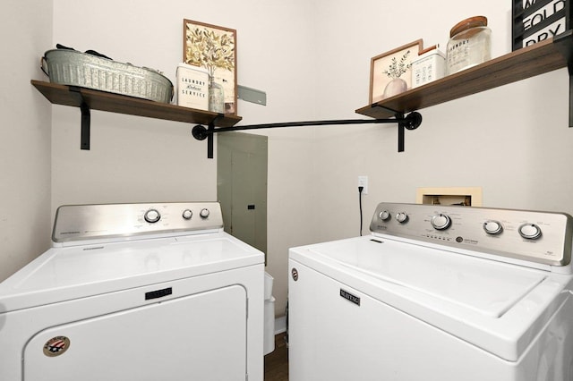 clothes washing area featuring a barn door and separate washer and dryer