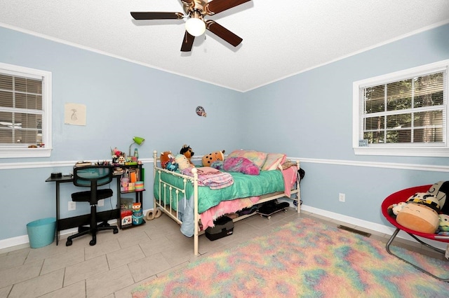 bedroom featuring tile patterned floors, ceiling fan, and ornamental molding