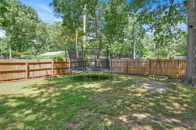 view of yard featuring a trampoline