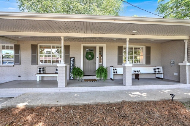 property entrance with a porch