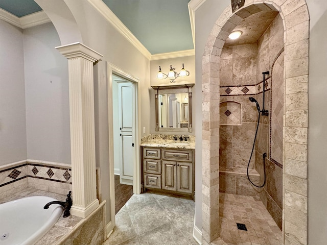 bathroom with separate shower and tub, decorative columns, vanity, and ornamental molding