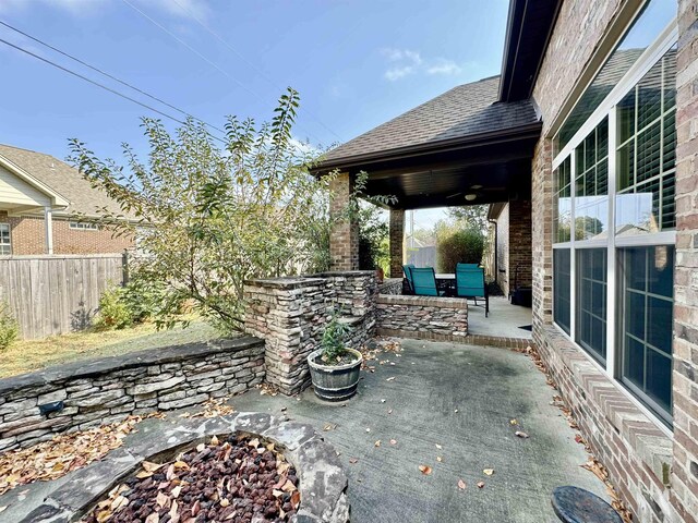 view of patio / terrace featuring an outdoor fire pit