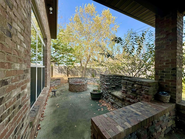 view of patio / terrace with a fire pit