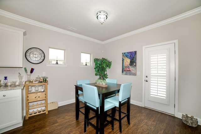  - dining space with baseboards, ornamental molding, dark wood-style flooring, and visible vents